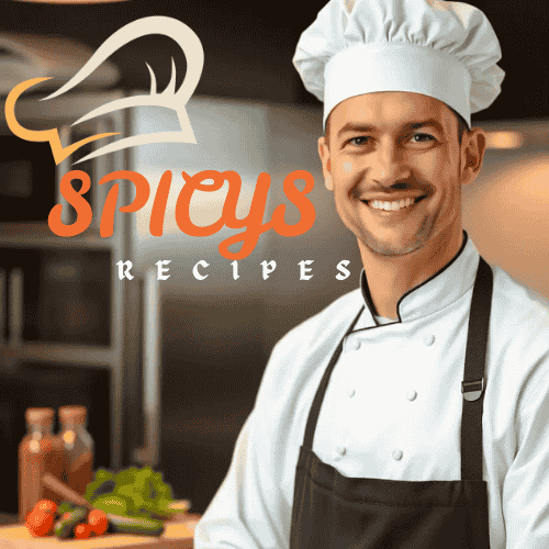 Jordan Mike, professional chef, standing in a modern kitchen wearing a white chef's uniform and hat, with the SpicysRecipes.com logo prominently displayed.